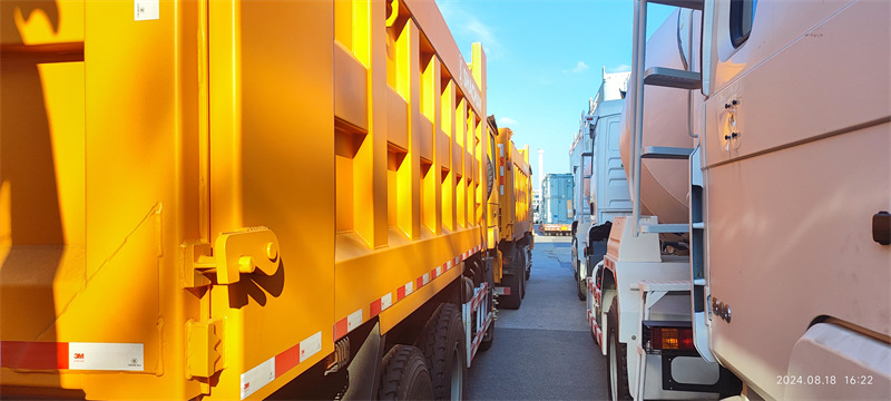 A Lineup of used Vehicles Prepared for Shipment: Exporting Success Stories from Our Port